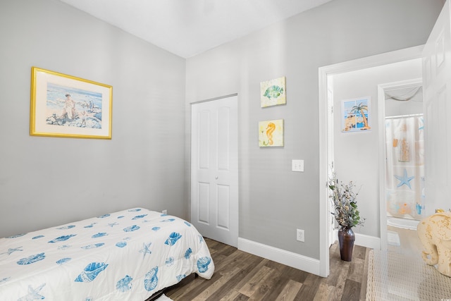 bedroom featuring wood finished floors and baseboards