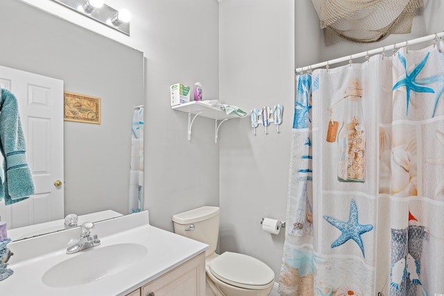 bathroom featuring toilet, vanity, and a shower with shower curtain