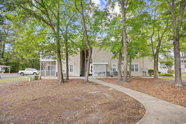 townhome / multi-family property featuring central AC