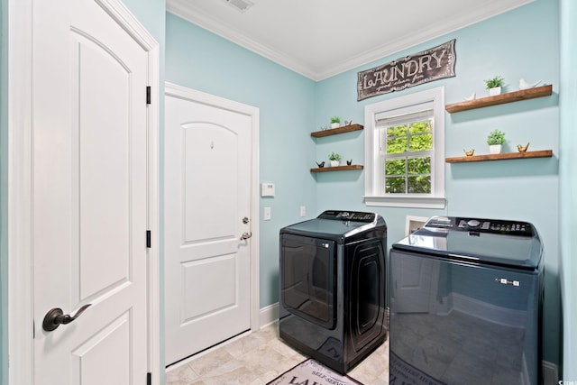 laundry area featuring separate washer and dryer and crown molding