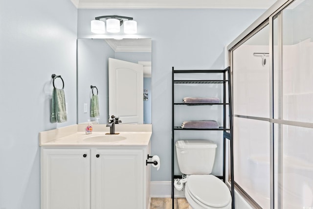 full bathroom featuring a stall shower, toilet, vanity, ornamental molding, and baseboards