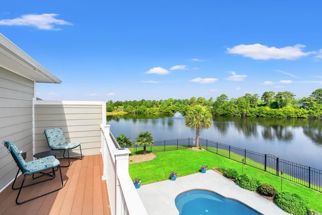 view of swimming pool with a water view