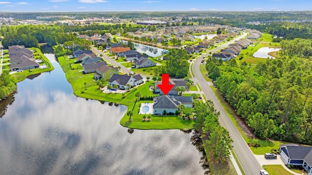 aerial view of residential area with a nearby body of water