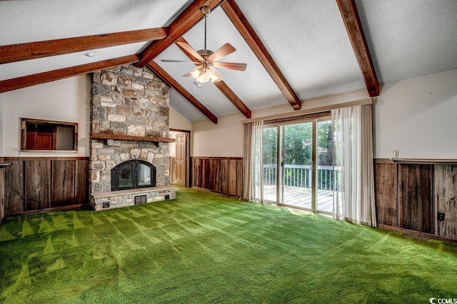 2010 Ye Olde Kings Hwy, North Myrtle Beach, SC 29582 - unfurnished living room featuring wainscoting, a fireplace, ceiling fan, wood walls, and carpet floors