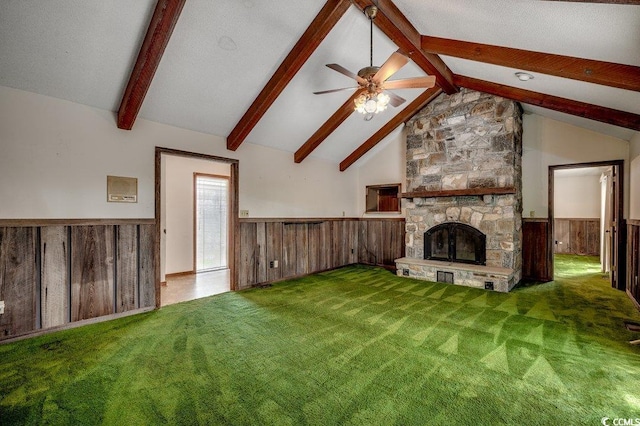 2010 Ye Olde Kings Hwy, North Myrtle Beach, SC 29582 - unfurnished living room with wainscoting, ceiling fan, carpet floors, a fireplace, and wood walls