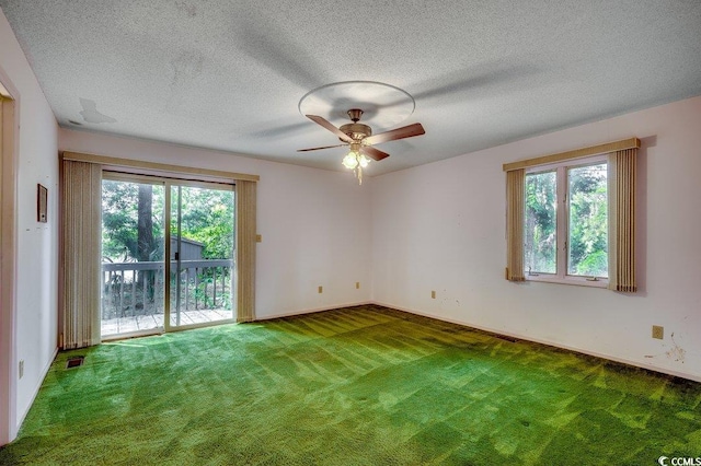 2010 Ye Olde Kings Hwy, North Myrtle Beach, SC 29582 - spare room with carpet, ceiling fan, a textured ceiling, and baseboards