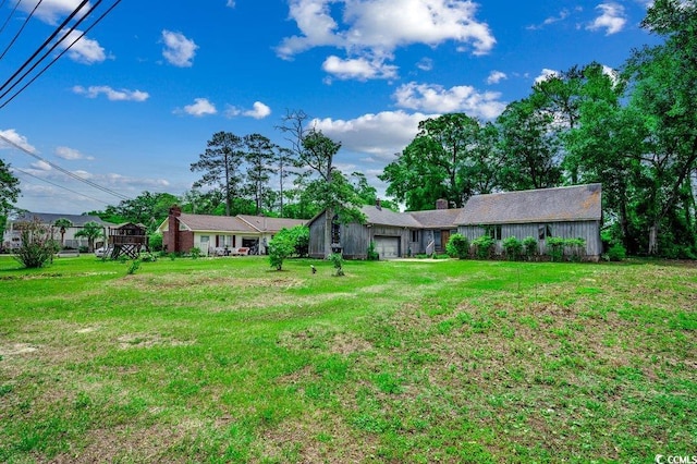 2010 Ye Olde Kings Hwy, North Myrtle Beach, SC 29582 - view of green lawn with a garage