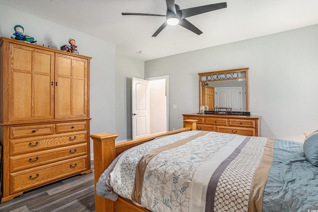 bedroom featuring dark wood-style floors and a ceiling fan