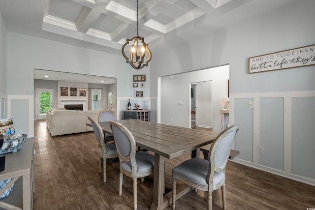 3620 Diamond Stars Way, Little River, SC 29566 - dining area with a high ceiling, coffered ceiling, a chandelier, beamed ceiling, and a fireplace