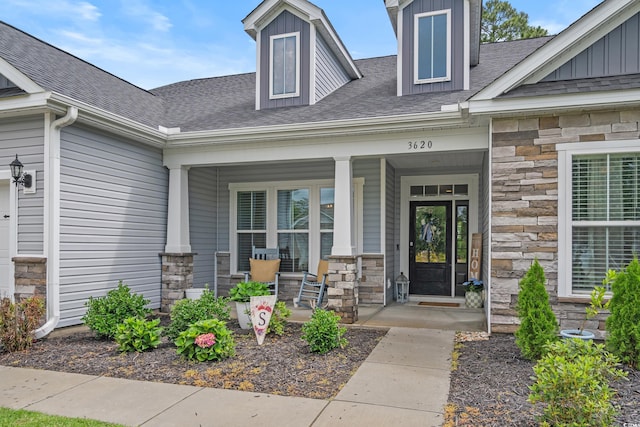 3620 Diamond Stars Way, Little River, SC 29566 - doorway to property with stone siding and a porch