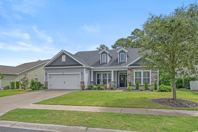 3620 Diamond Stars Way, Little River, SC 29566 - view of front of property featuring stone siding, a front lawn, an attached garage, and concrete driveway