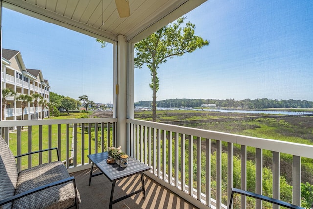 4450 Turtle Ln Unit 2-A, Little River, SC 29566 - balcony featuring a ceiling fan and a water view