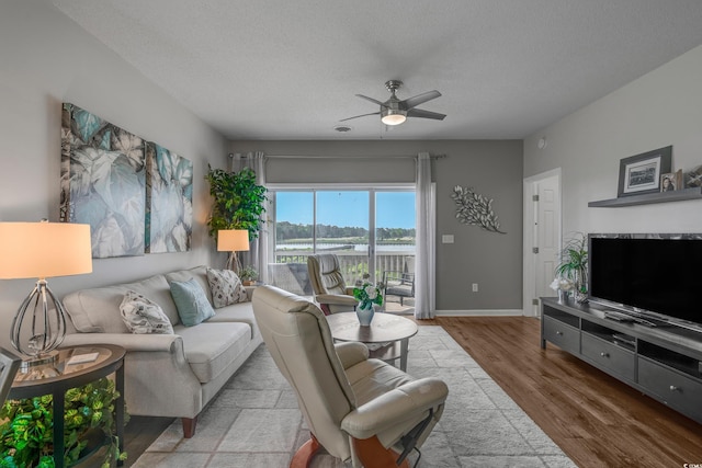 4450 Turtle Ln Unit 2-A, Little River, SC 29566 - living area with wood finished floors, ceiling fan, a textured ceiling, and baseboards