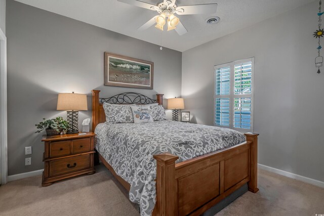 4450 Turtle Ln Unit 2-A, Little River, SC 29566 - bedroom with light carpet, baseboards, and a ceiling fan