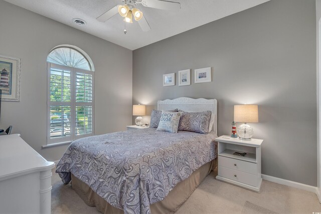 4450 Turtle Ln Unit 2-A, Little River, SC 29566 - bedroom featuring light colored carpet, baseboards, and a ceiling fan