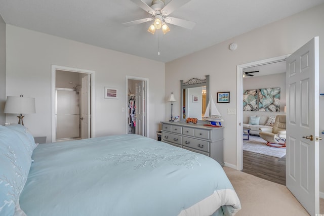 4450 Turtle Ln Unit 2-A, Little River, SC 29566 - bedroom with light carpet, a walk in closet, a ceiling fan, and baseboards