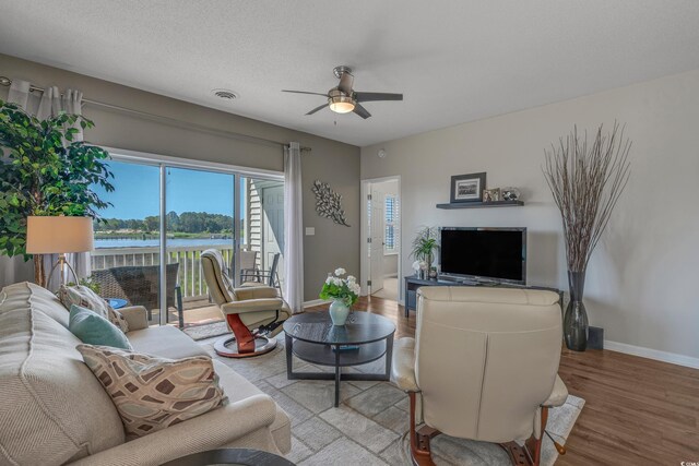4450 Turtle Ln Unit 2-A, Little River, SC 29566 - living room featuring wood finished floors, baseboards, and ceiling fan