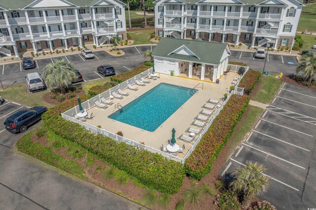 4450 Turtle Ln Unit 2-A, Little River, SC 29566 - community pool with fence and a patio area