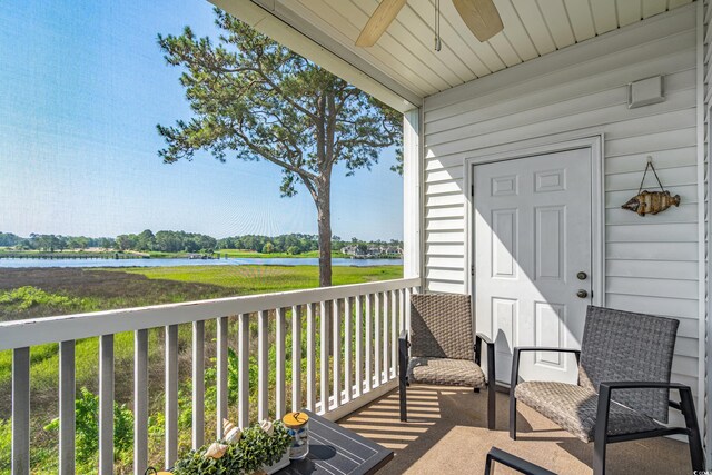 4450 Turtle Ln Unit 2-A, Little River, SC 29566 - balcony featuring a ceiling fan and a water view