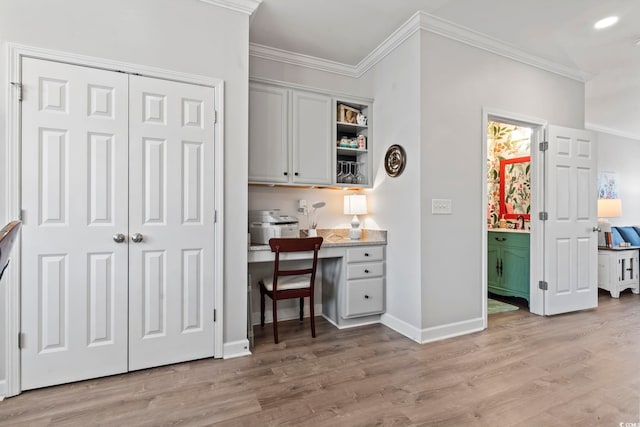 815 Murray Ave, Myrtle Beach, SC 29577 - home office with built in desk, crown molding, light wood-style floors, and baseboards