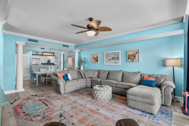 100 N Beach Blvd Unit 515, North Myrtle Beach, SC 29582 - living area with wood finished floors, ceiling fan, crown molding, and ornate columns