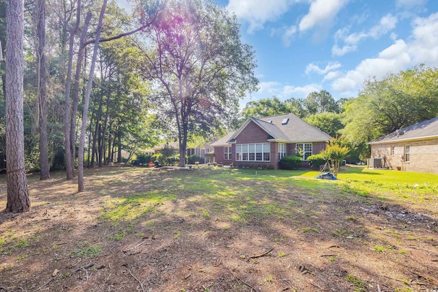 3071 Alice Ln, Little River, SC 29566 - view of grassy yard featuring central AC