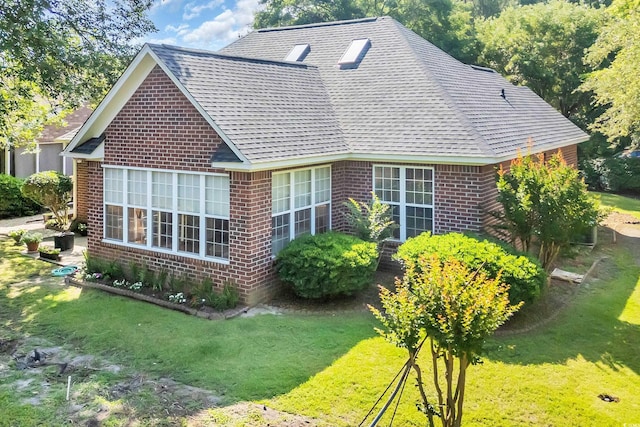 3071 Alice Ln, Little River, SC 29566 - view of property exterior with brick siding, a lawn, and a shingled roof