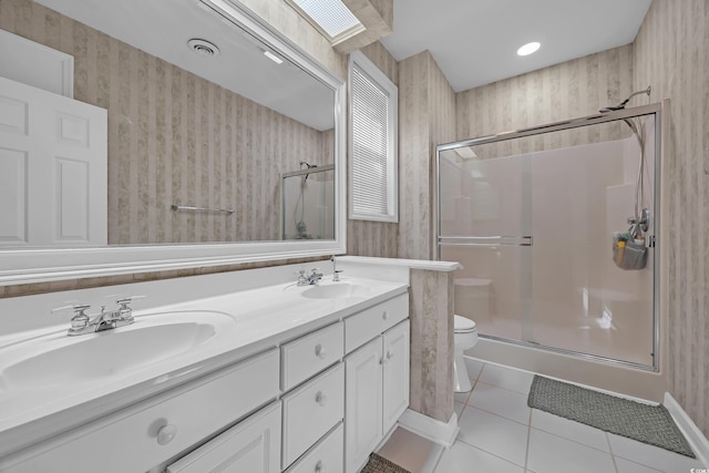 3071 Alice Ln, Little River, SC 29566 - bathroom with a shower stall, double vanity, tile patterned flooring, and wallpapered walls