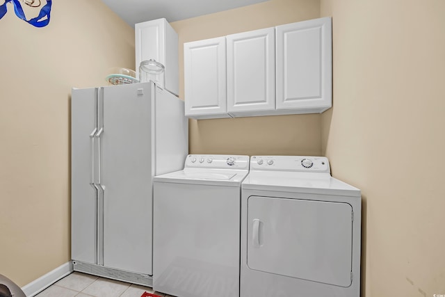 3071 Alice Ln, Little River, SC 29566 - laundry area with washing machine and dryer, light tile patterned floors, and cabinet space