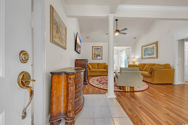 3071 Alice Ln, Little River, SC 29566 - living area featuring decorative columns, ceiling fan, vaulted ceiling, and light tile patterned flooring