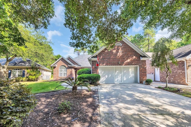 3071 Alice Ln, Little River, SC 29566 - view of front of property with brick siding, driveway, an attached garage, and a front yard