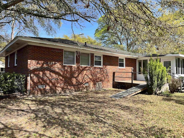 505 1st Ave S, North Myrtle Beach, SC 29582 - view of side of home with brick siding and crawl space