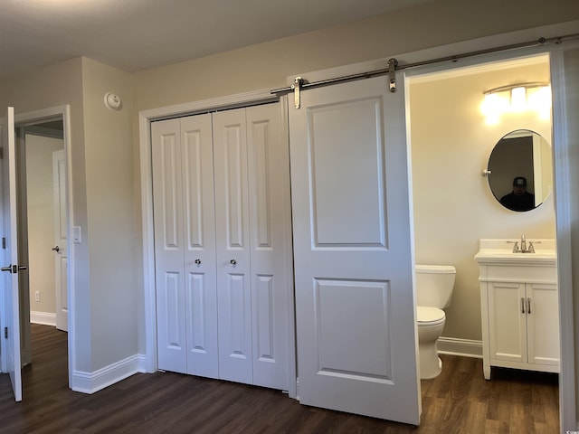 505 1st Ave S, North Myrtle Beach, SC 29582 - bathroom with wood finished floors, toilet, vanity, and baseboards