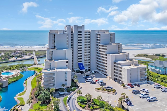 aerial view of a large body of water and apartment complex