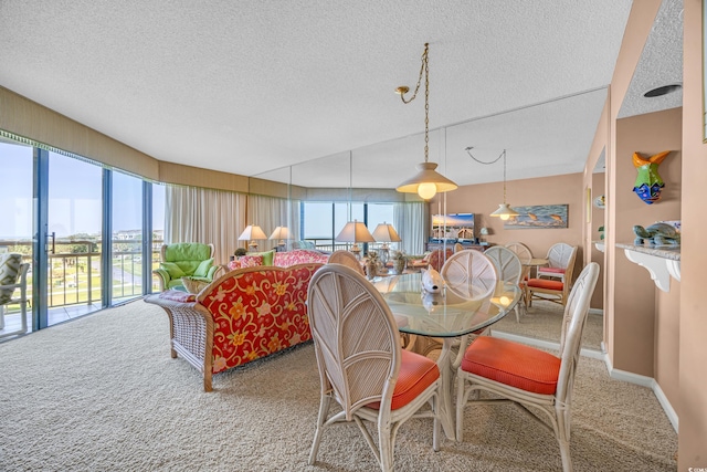 dining space with carpet flooring and a textured ceiling
