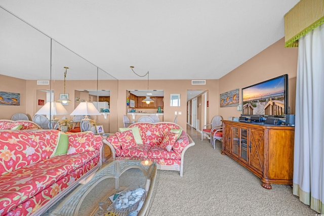 living area featuring carpet