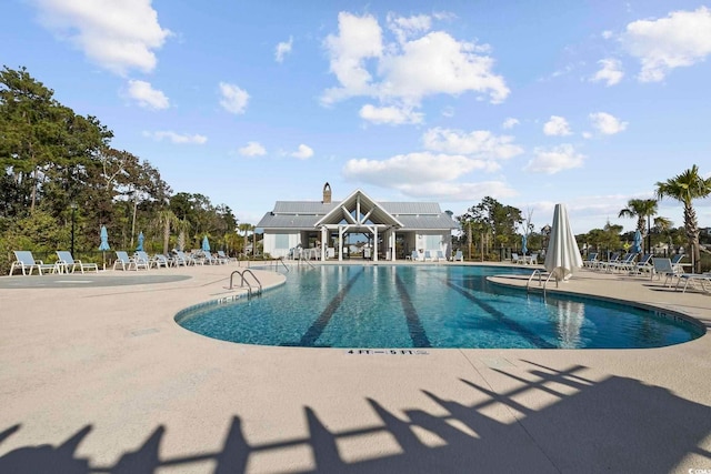 community pool featuring a patio area