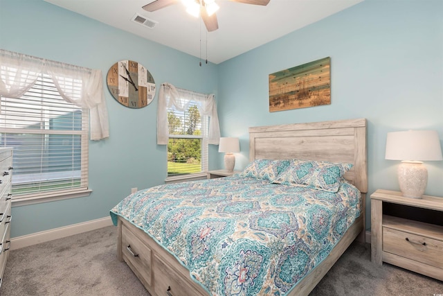 carpeted bedroom with baseboards and a ceiling fan