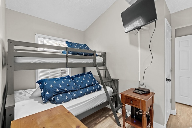 6001-1732 S Kings Hwy, Myrtle Beach, SC 29575 - bedroom with wood finished floors, lofted ceiling, and baseboards