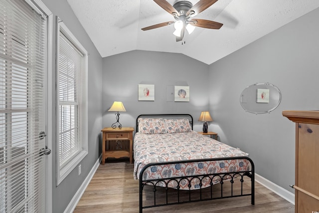 6001-1732 S Kings Hwy, Myrtle Beach, SC 29575 - bedroom featuring wood finished floors, lofted ceiling, baseboards, a ceiling fan, and a textured ceiling