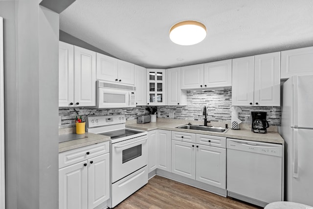 6001-1732 S Kings Hwy, Myrtle Beach, SC 29575 - kitchen featuring white appliances, a sink, tasteful backsplash, light countertops, and a textured ceiling
