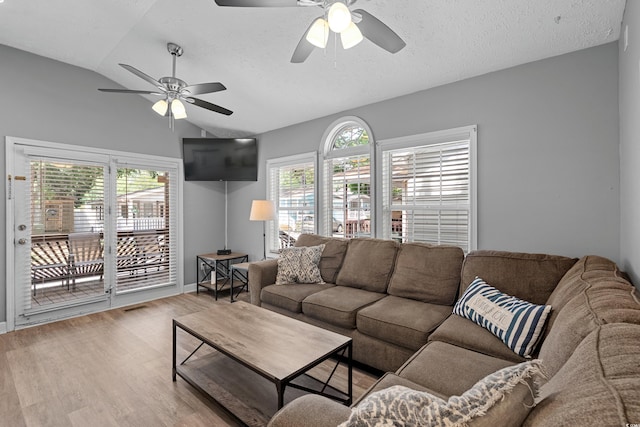 6001-1732 S Kings Hwy, Myrtle Beach, SC 29575 - living area featuring vaulted ceiling, a ceiling fan, wood finished floors, a textured ceiling, and baseboards