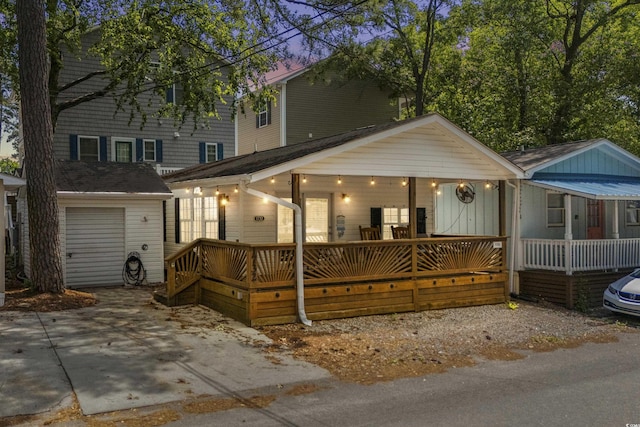 6001-1732 S Kings Hwy, Myrtle Beach, SC 29575 - view of front facade with a porch, an outdoor structure, and a garage