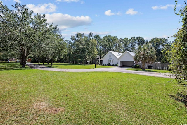 62 Warbler St, Georgetown, SC 29440 - view of yard featuring concrete driveway