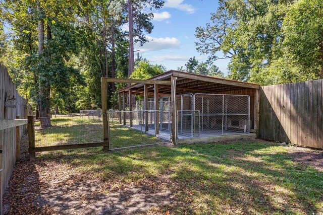 62 Warbler St, Georgetown, SC 29440 - fenced backyard with an outdoor structure