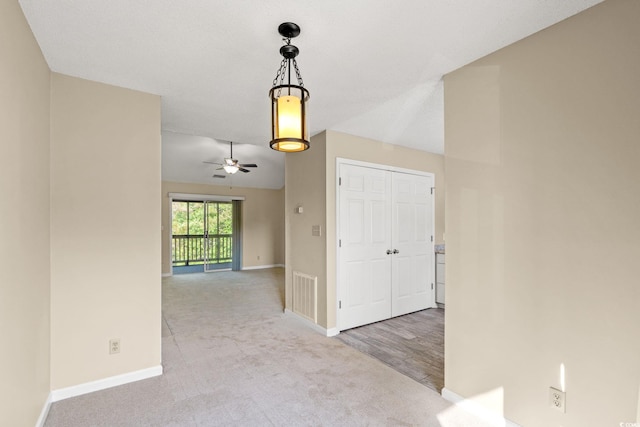 hall with carpet and baseboards