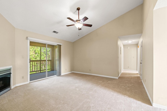 unfurnished living room with carpet flooring, a ceiling fan, baseboards, a fireplace, and high vaulted ceiling