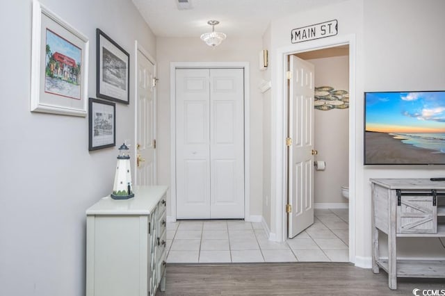 404 1st Ave N Unit H, North Myrtle Beach, SC 29582 - foyer featuring light tile patterned floors and baseboards