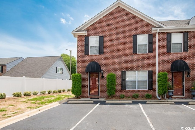 404 1st Ave N Unit H, North Myrtle Beach, SC 29582 - multi unit property featuring uncovered parking and brick siding