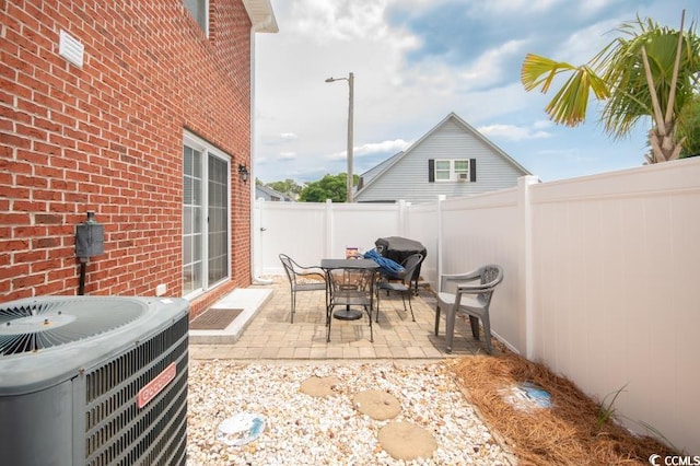 404 1st Ave N Unit H, North Myrtle Beach, SC 29582 - fenced backyard featuring central AC unit and a patio area